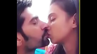 Indian newly married couple kiss